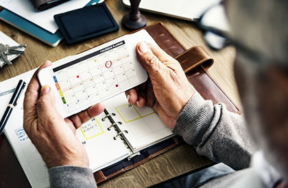 Hands holding a calendar