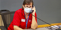 Muskokee volunteer answers phone