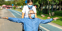 Nurse with elderly patient in wheelchair
