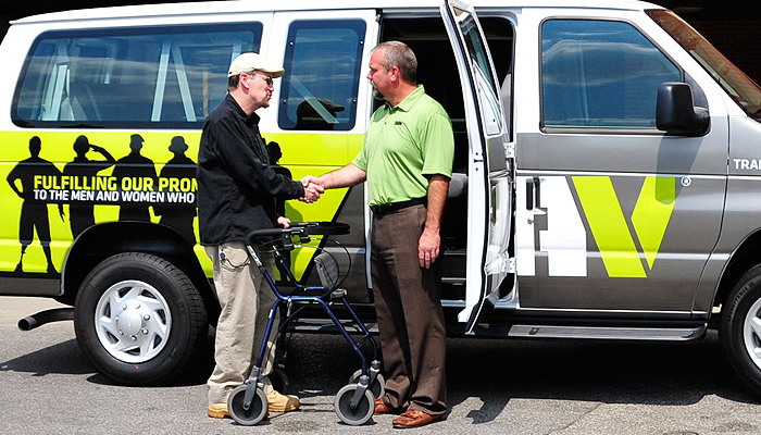 DAV National Adjutant, Marc Burgess greeting a Veteran as he leaves a VA Medical Center